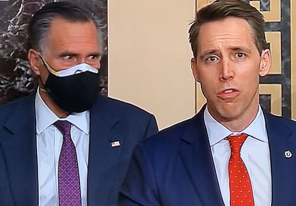 Mitt Romney glares at Josh Hawley from the U.S. Senate floor